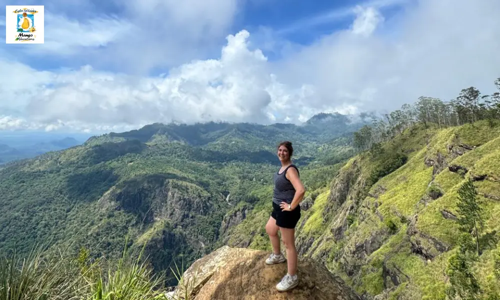 Mango Vacations female traveler enjoying the breathtaking view from Little Adam's Peak, Ella, Sri Lanka